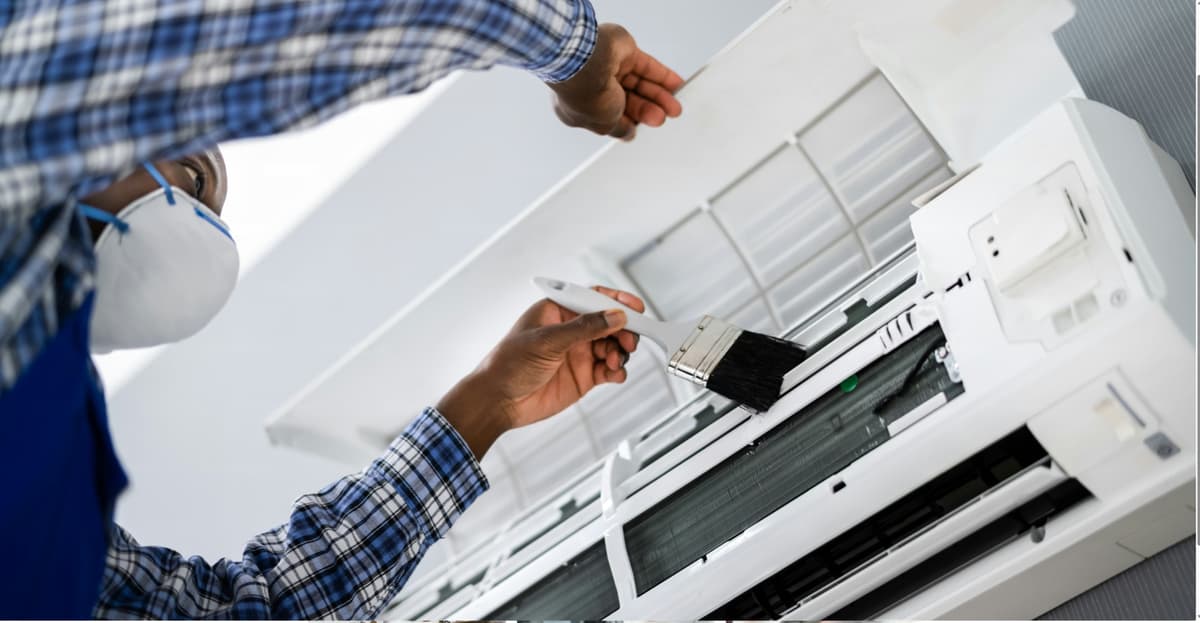AC repair technician filling gas