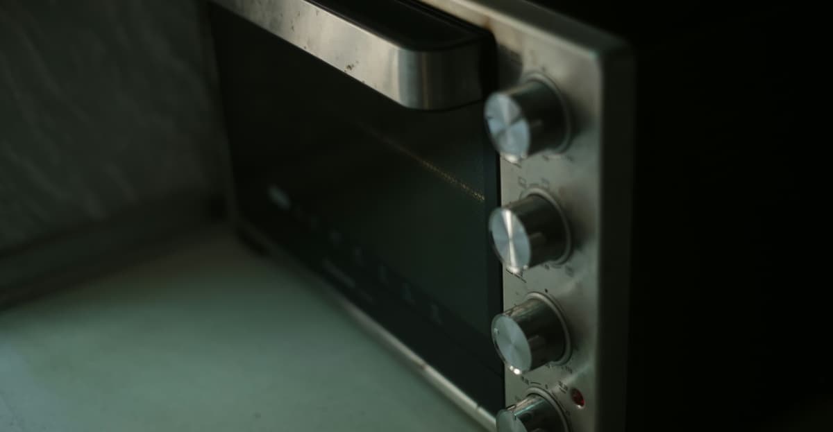 Professional technician servicing a microwave oven